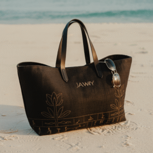 “Luxury black JAWWY tote bag with gold Egyptian-inspired embroidery and genuine leather handles — an elegant, spacious statement bag crafted for refined everyday use.”